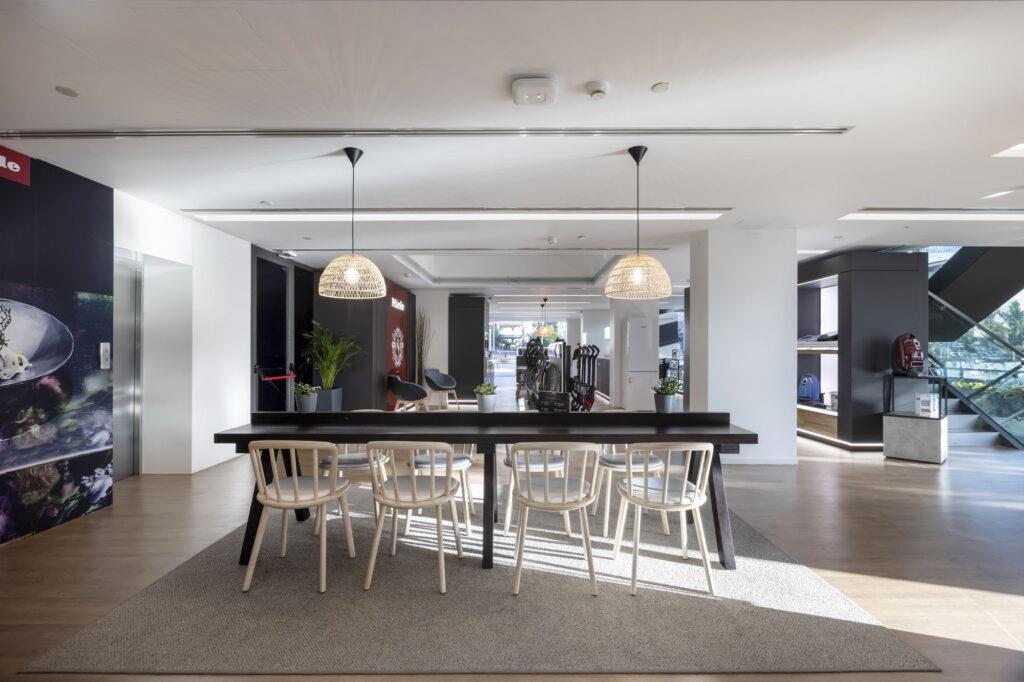 showroom area with a dinning table with chairs and lights