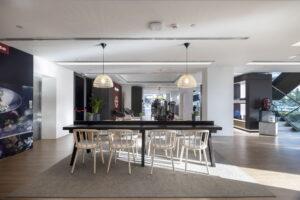 showroom area with a dinning table with chairs and lights