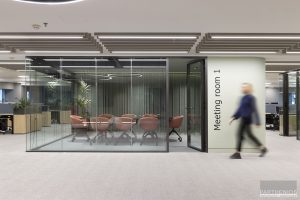 external view of meeting room with glass partitions at workspaces